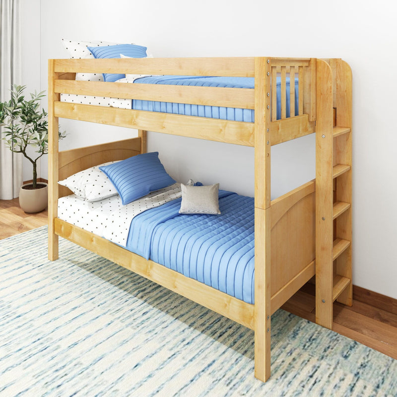 Natural wood bunk bed with blue quilted bedding and built-in ladder in modern kids' bedroom, space-saving children's furniture