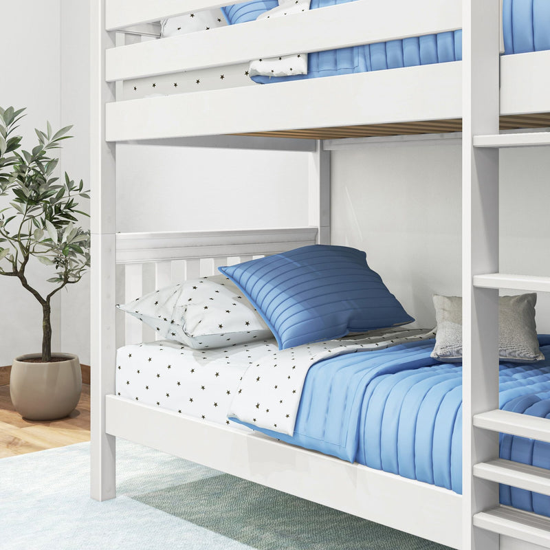 White wooden bunk bed with blue quilt and star print sheets, ladder and potted plant in modern kids' bedroom