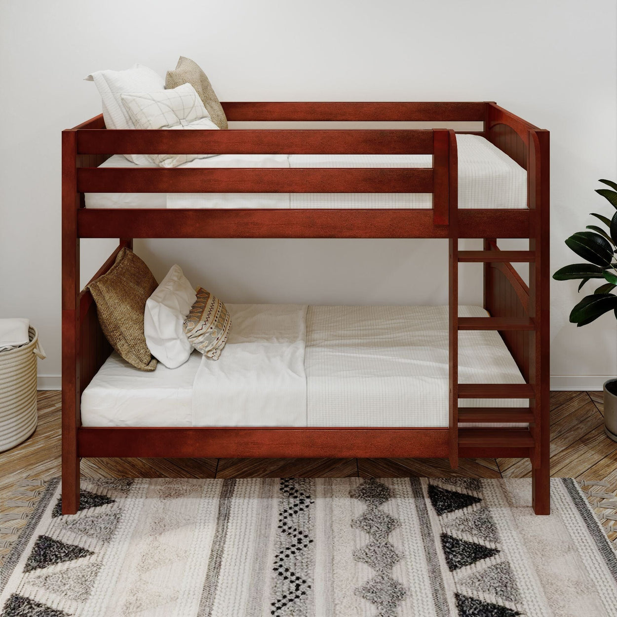 Wooden bunk bed with white bedding and decorative cushions in a modern bedroom setting.