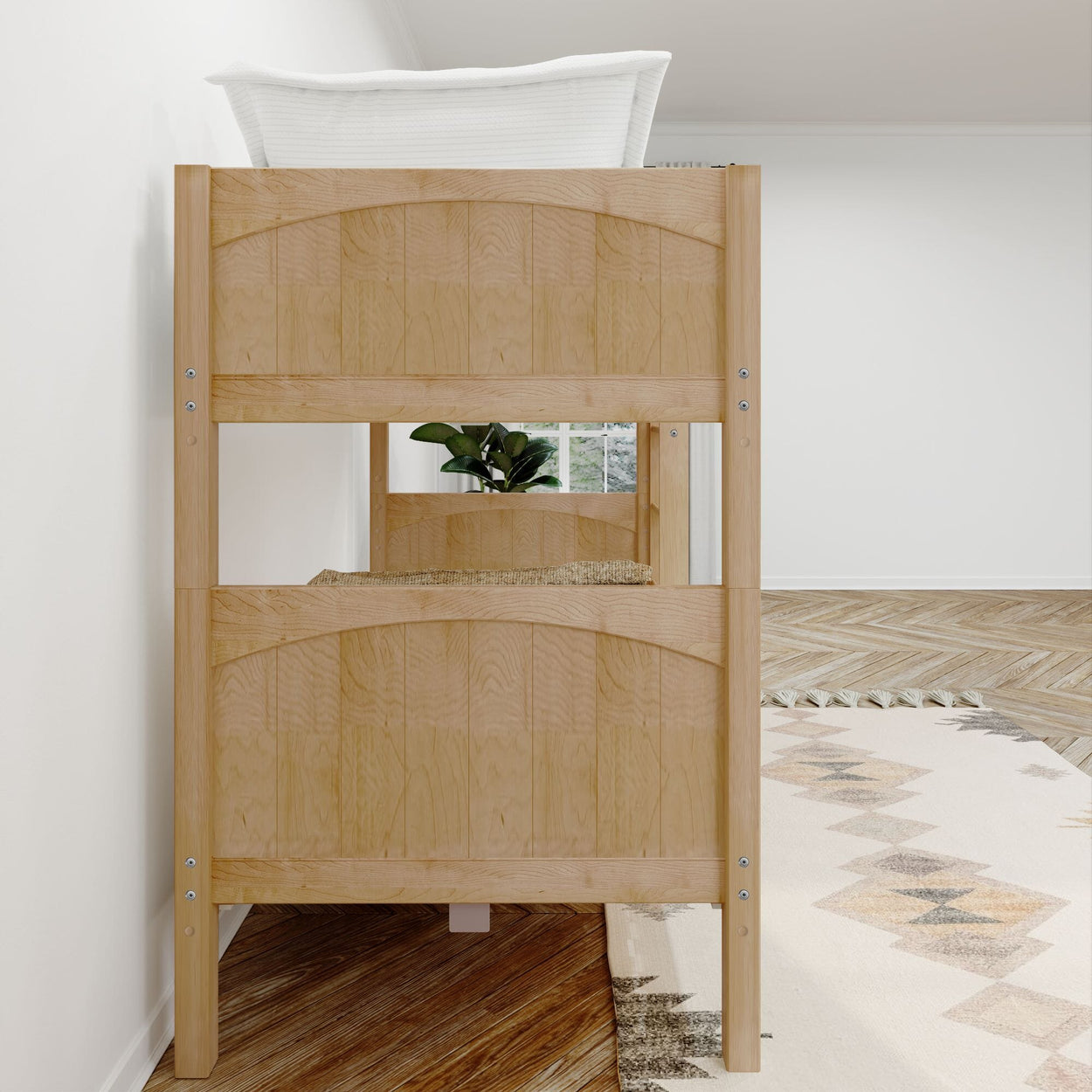 Wooden bunk bed with natural finish in a modern bedroom setting featuring a potted plant and a woven rug.