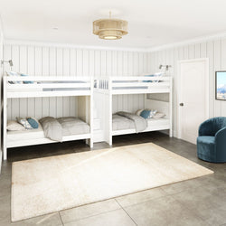 Four white bunk beds in a spacious, modern bedroom with beige walls and tiled floor.