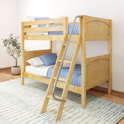 Wooden bunk bed with ladder in modern kids' room, featuring blue bedding and a striped rug.