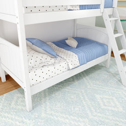 White wooden bunk bed with blue and star-patterned bedding on a light blue rug in a children's room.