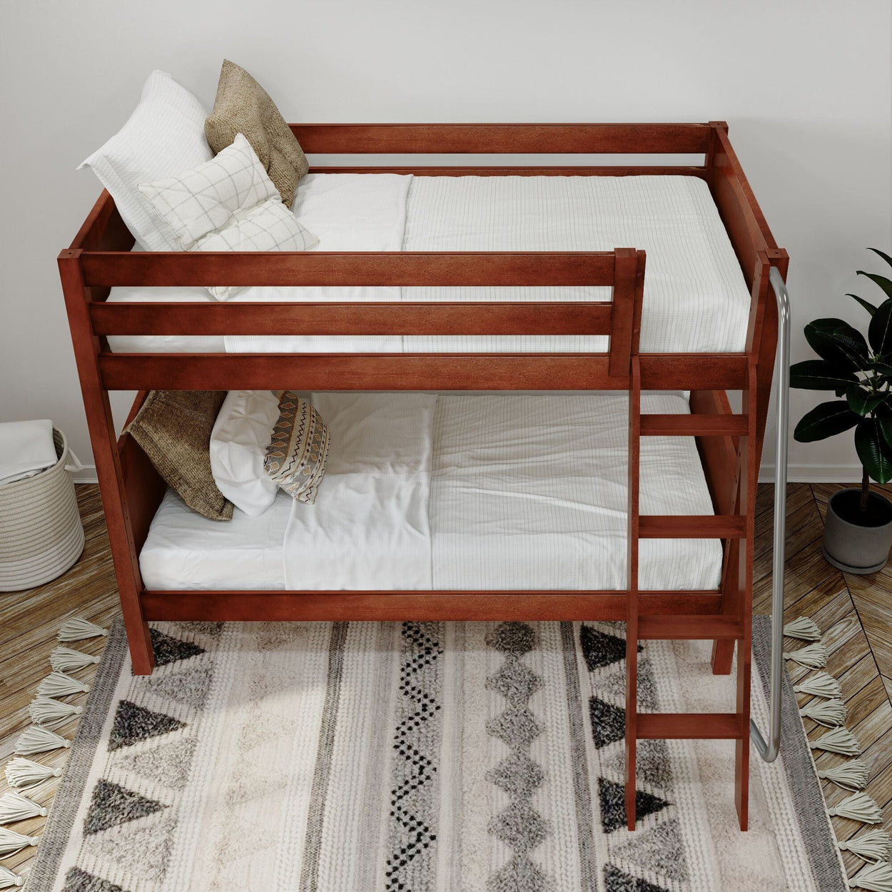 Wooden bunk bed with white bedding and decorative pillows in a modern bedroom setting.