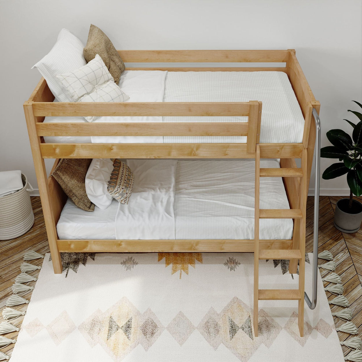 Wooden bunk bed with white bedding in a cozy, modern bedroom setting.