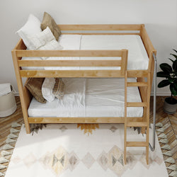 Wooden bunk bed with white bedding in a cozy, modern bedroom setting.
