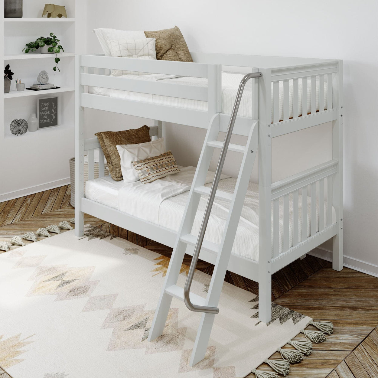 White wooden bunk bed with ladder in modern children's bedroom featuring cozy pillows and decorative rug.