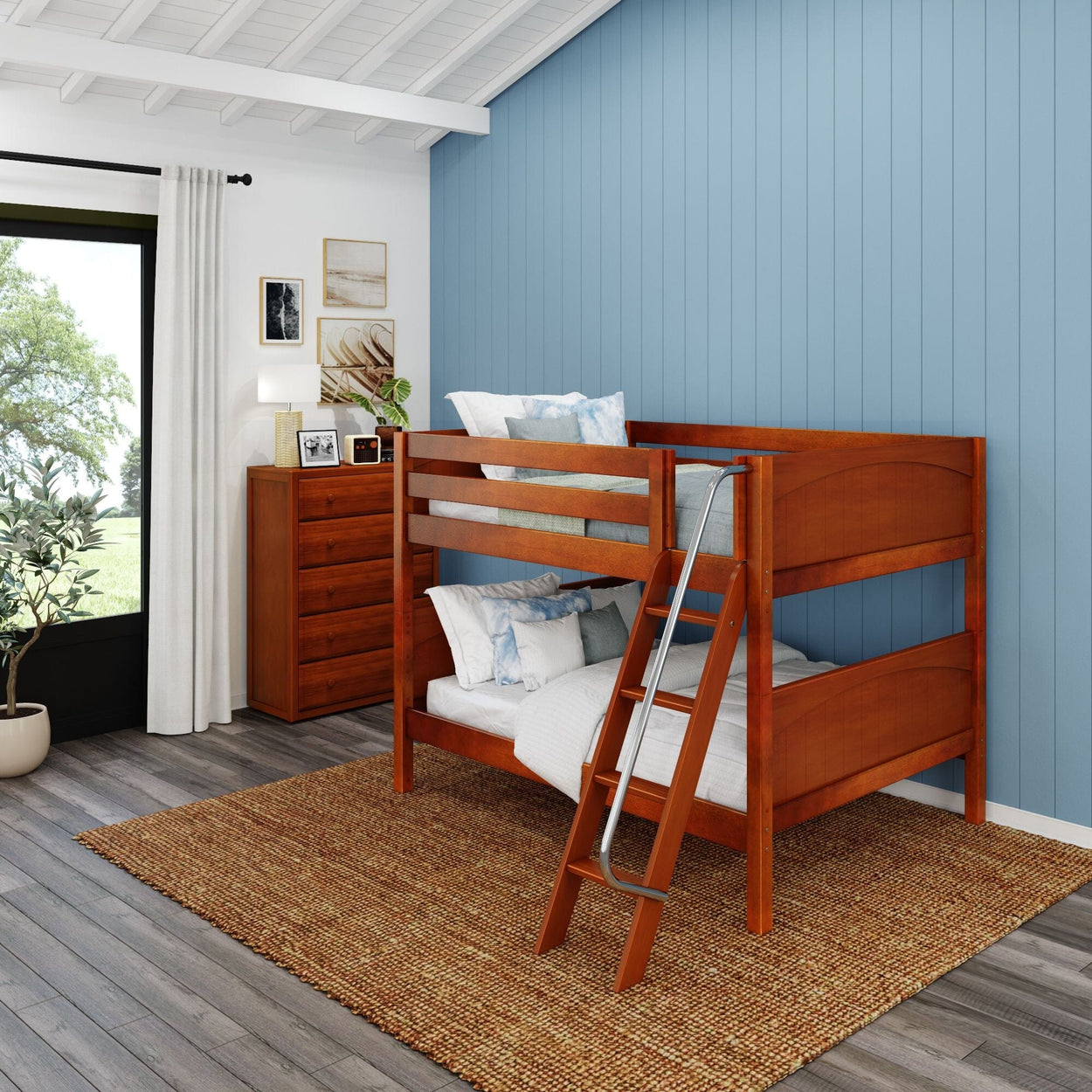 Wooden bunk bed in a cozy bedroom with blue walls and natural lighting.