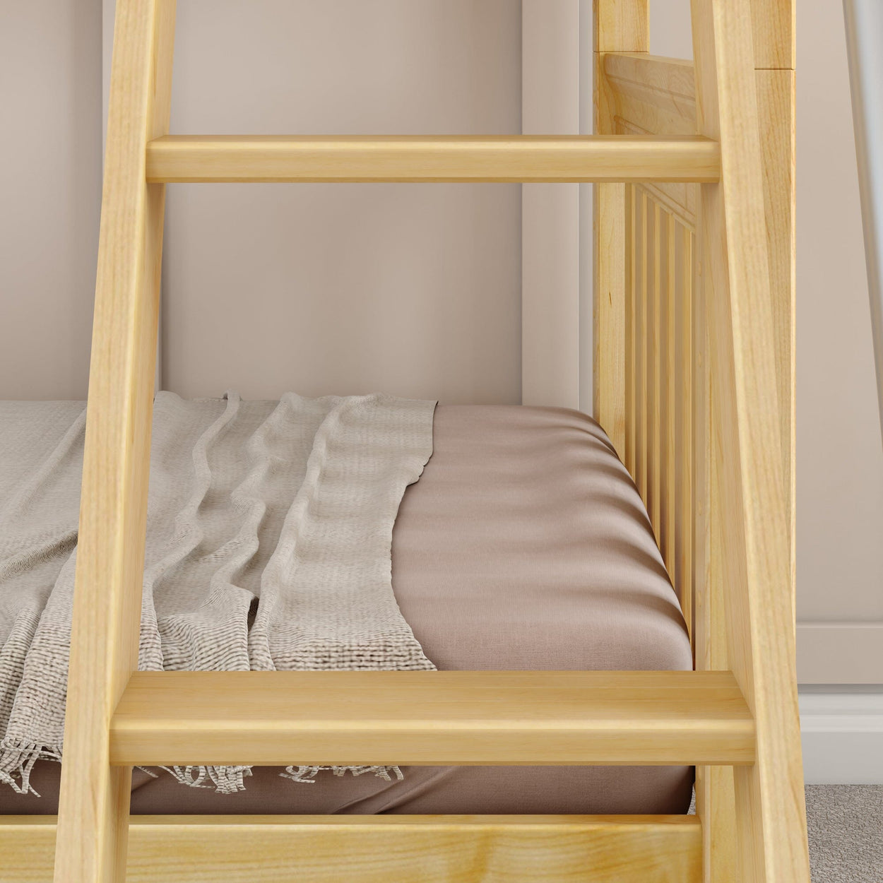 Wooden bunk bed with soft beige bedding and a cozy blanket in a modern bedroom setting.