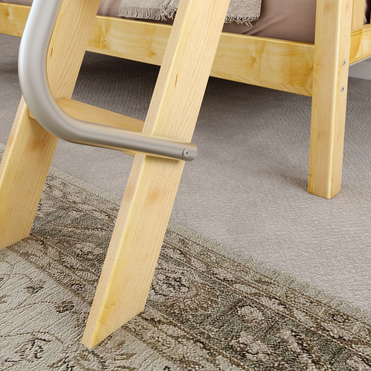 Wooden ladder on carpeted floor with patterned rug, connected to a bed frame.