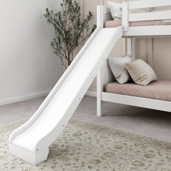 White loft bed with slide and cozy pillows in a modern kids' bedroom.