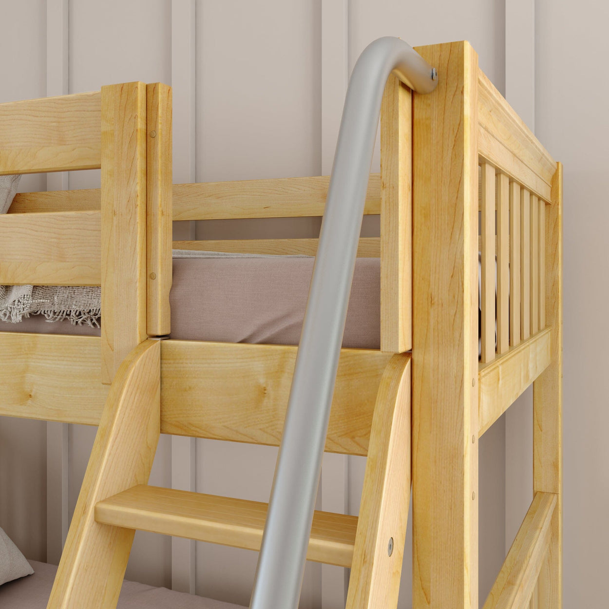 Wooden bunk bed ladder with metal railing in a cozy bedroom setting.