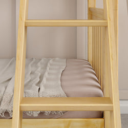 Wooden bunk bed detail with beige bedding and a cozy light gray throw blanket.
