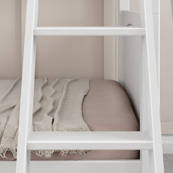 White wooden bunk bed ladder next to cozy pink bedding with beige blanket.