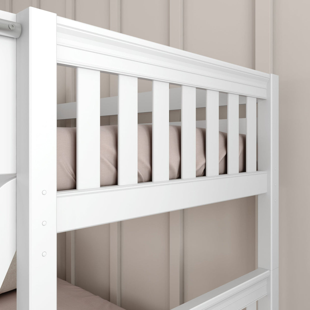 White wooden bunk bed with beige bedding against a neutral wall.