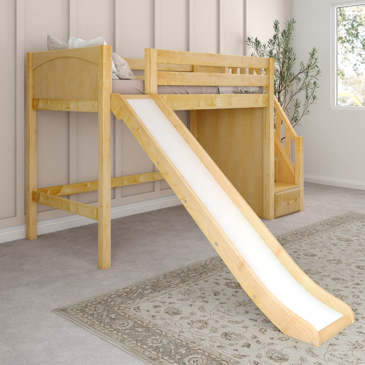 Wooden loft bed with slide and stairs in a modern kids' room, featuring neutral decor and a patterned rug.
