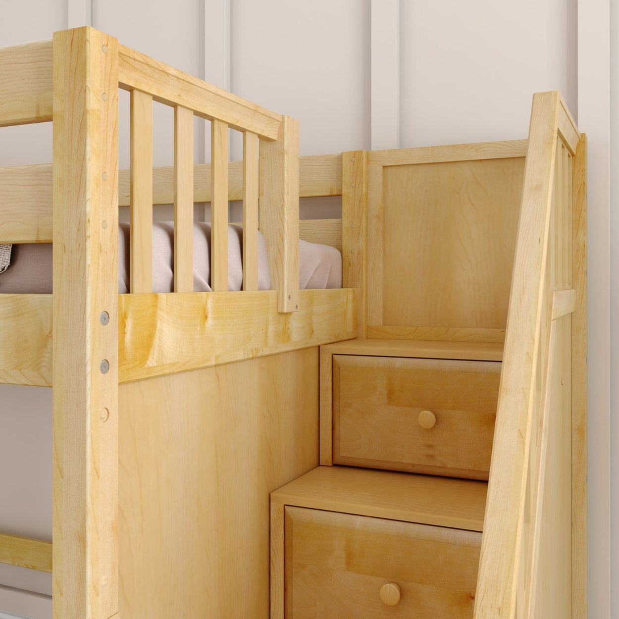 Wooden bunk bed with integrated storage drawers and safety railing.