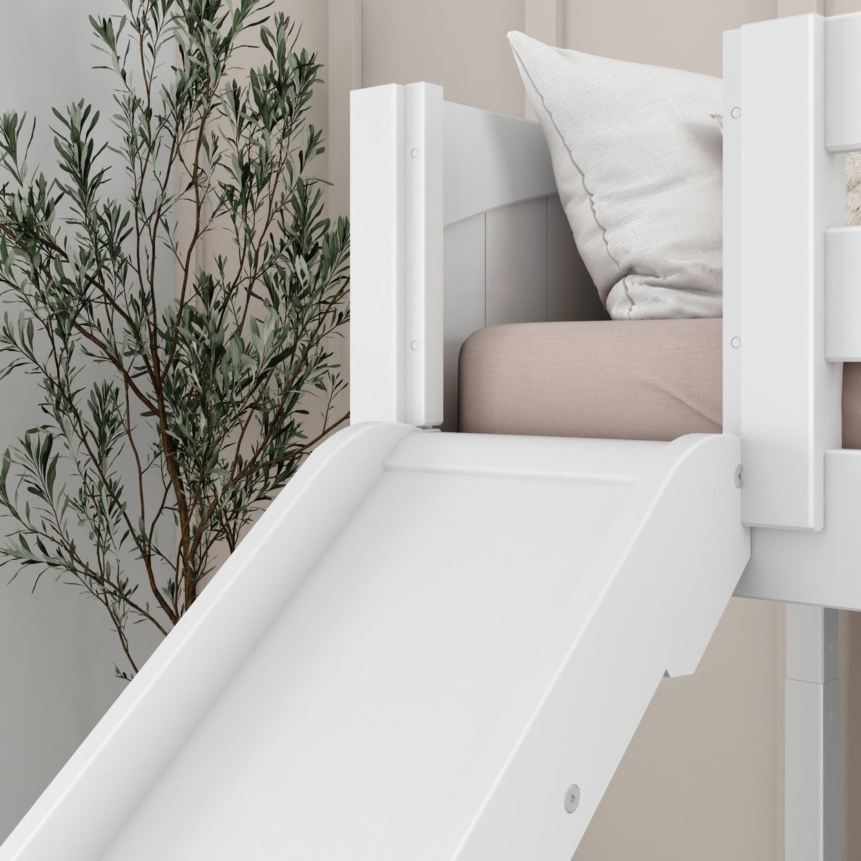 White children's loft bed with slide and beige bedding, next to a houseplant, in a modern bedroom setting.