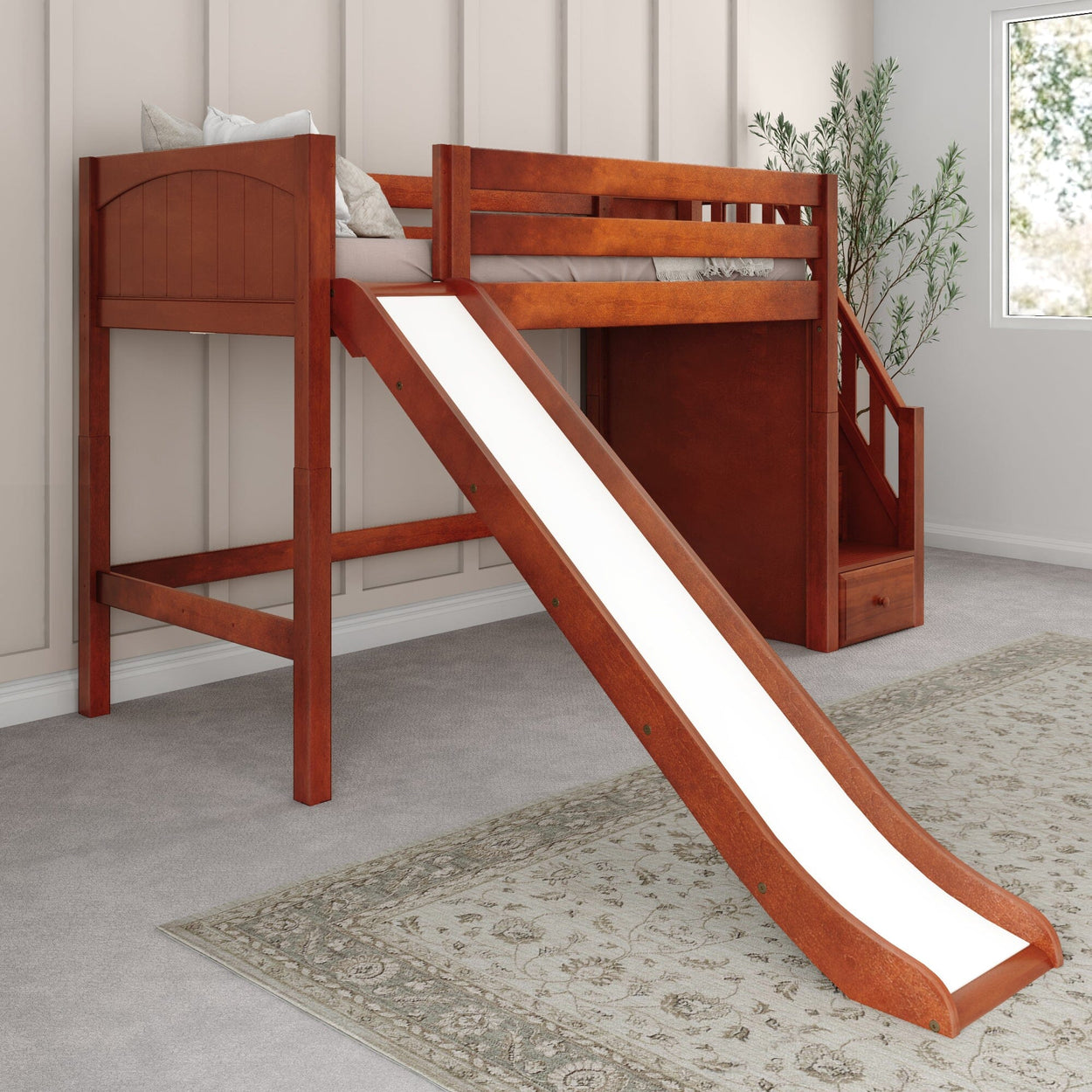 Kids wooden loft bed with slide and stairs in a modern bedroom setting.