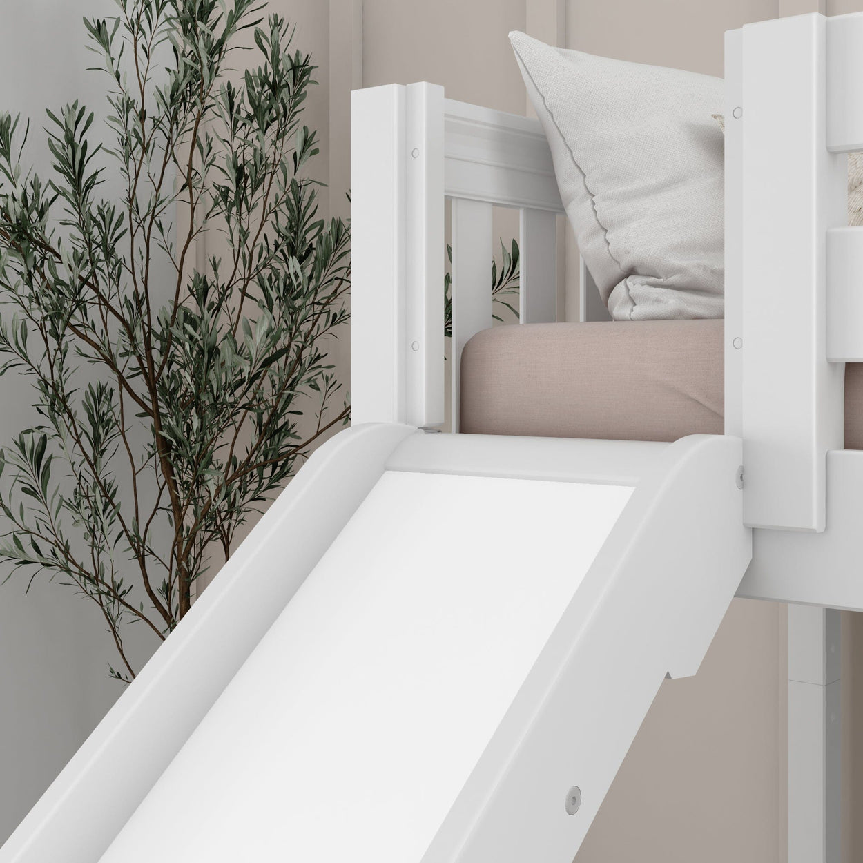 White children's loft bed with slide and pillows in modern bedroom decor.