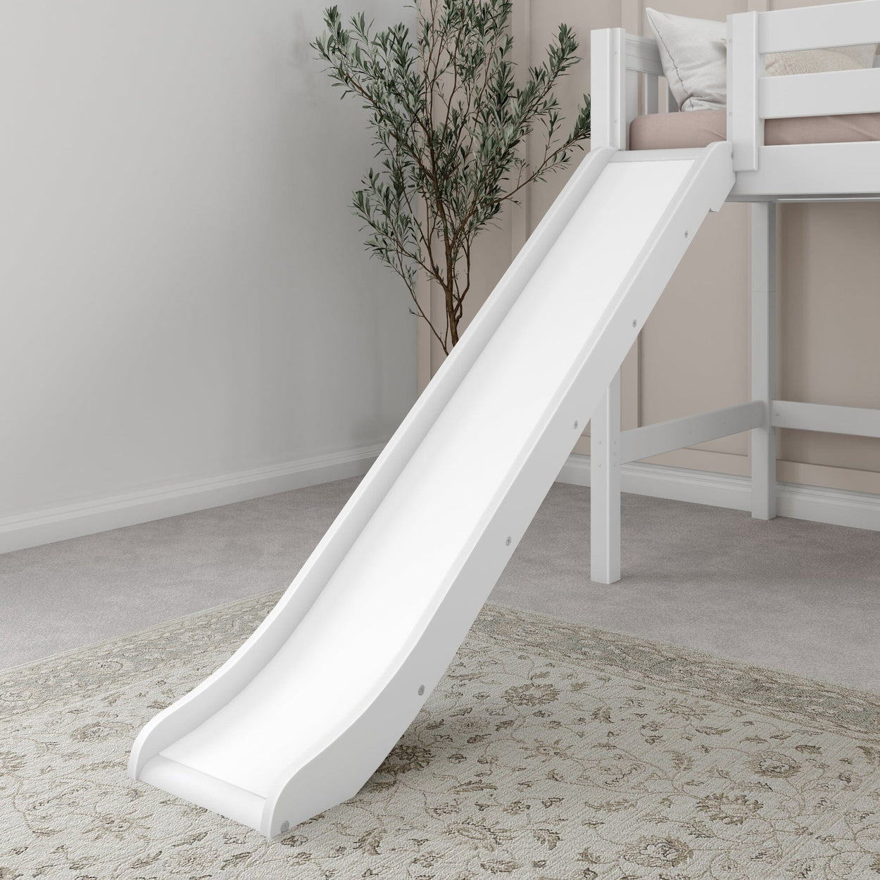 White indoor slide attached to loft bed in children's playroom with neutral decor and cozy rug.