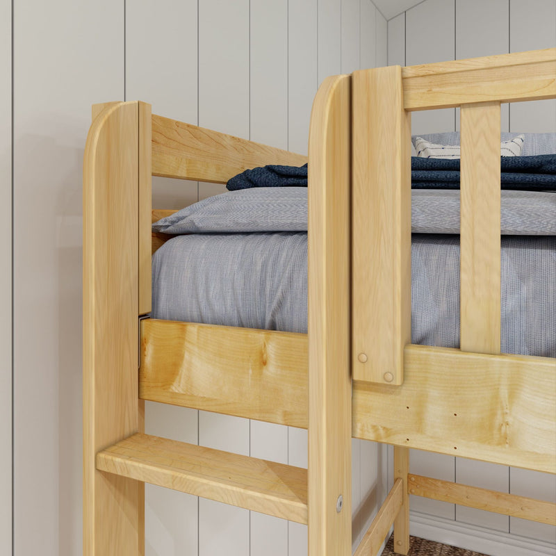 Solid pine bunk bed close-up with natural wood finish, built-in ladder and blue-gray bedding against white shiplap wall in kids' bedroom