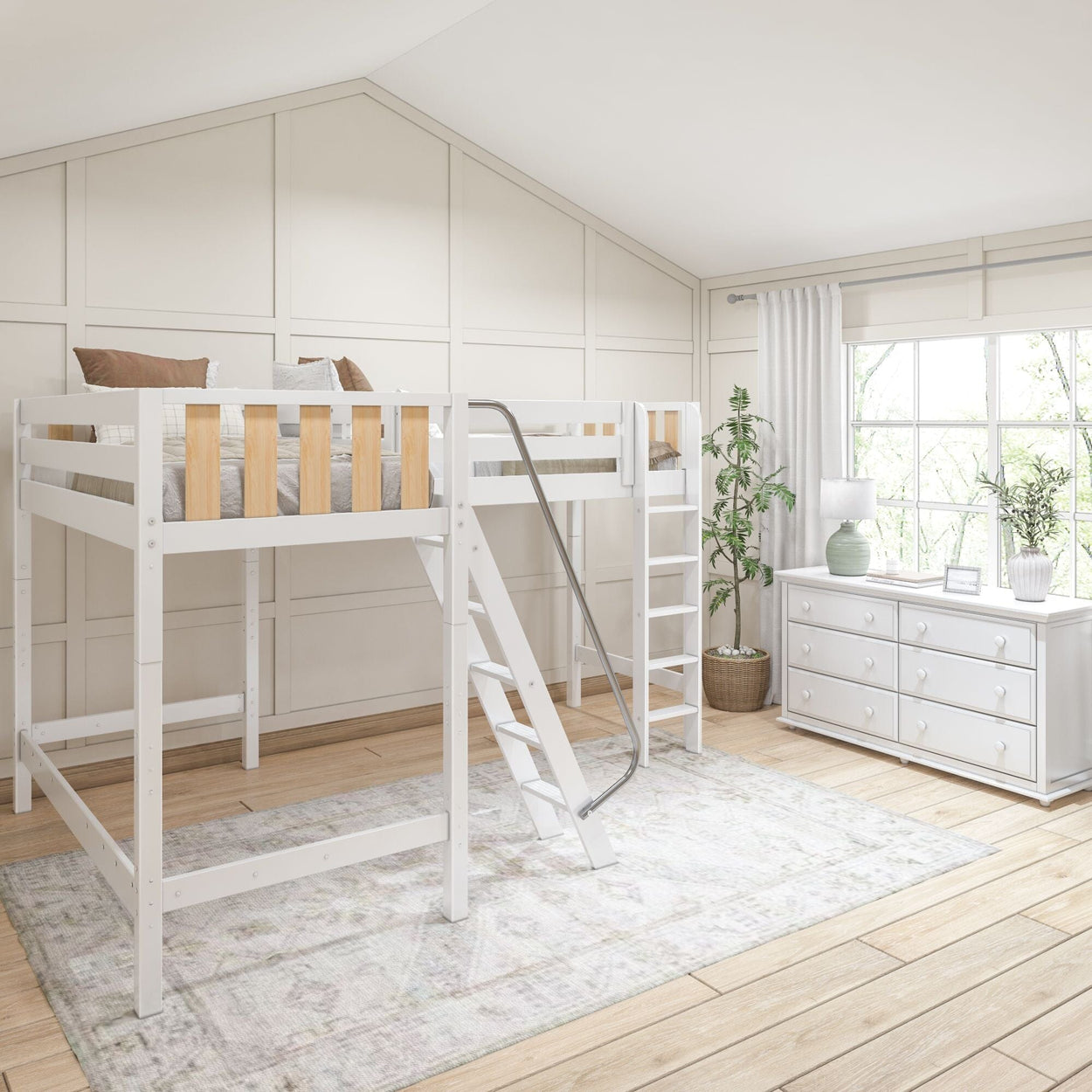 White loft bed in a modern bedroom with wooden flooring, white dresser, indoor plants, and natural light from large window.