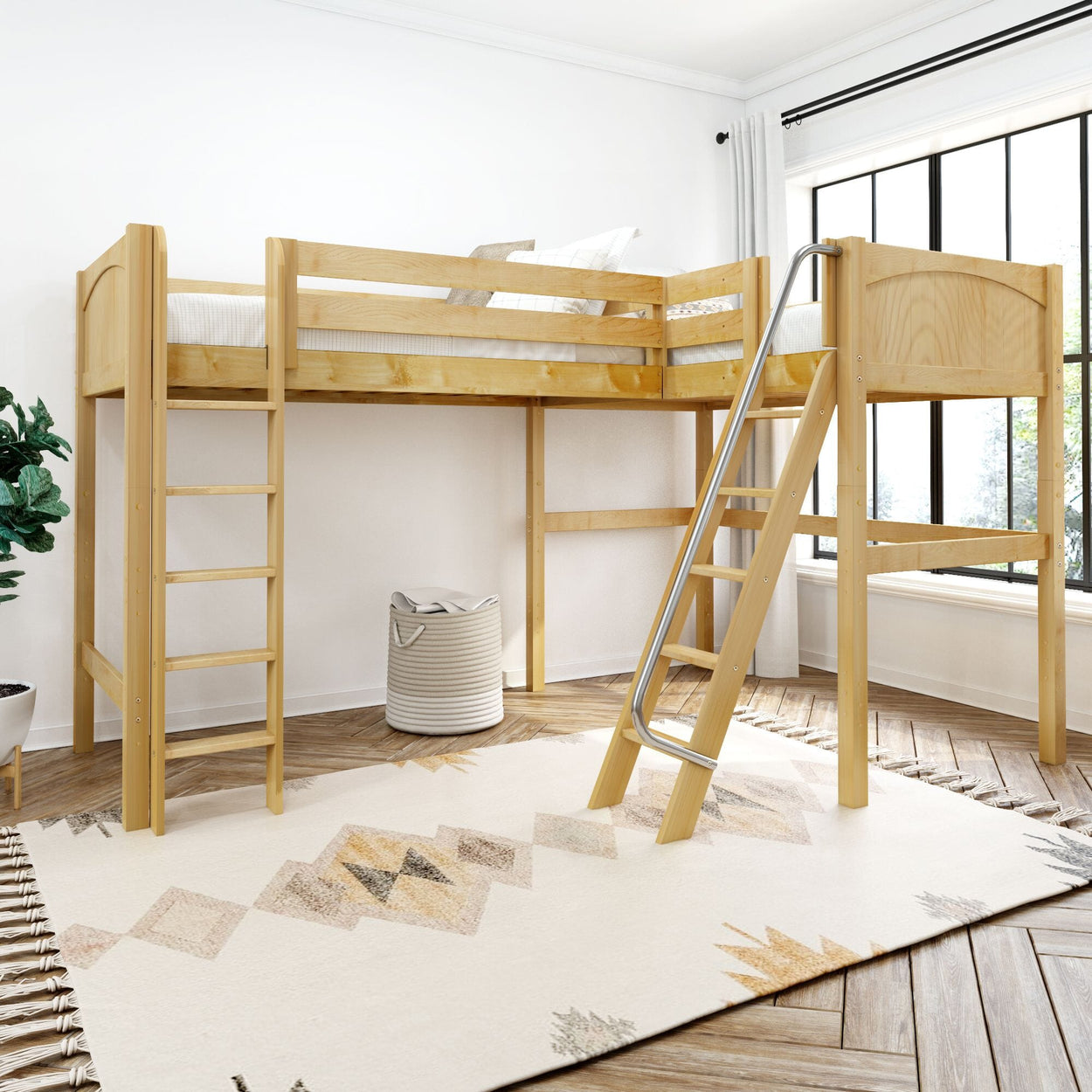 Wooden loft bed with slide and ladder in modern bedroom with large window.