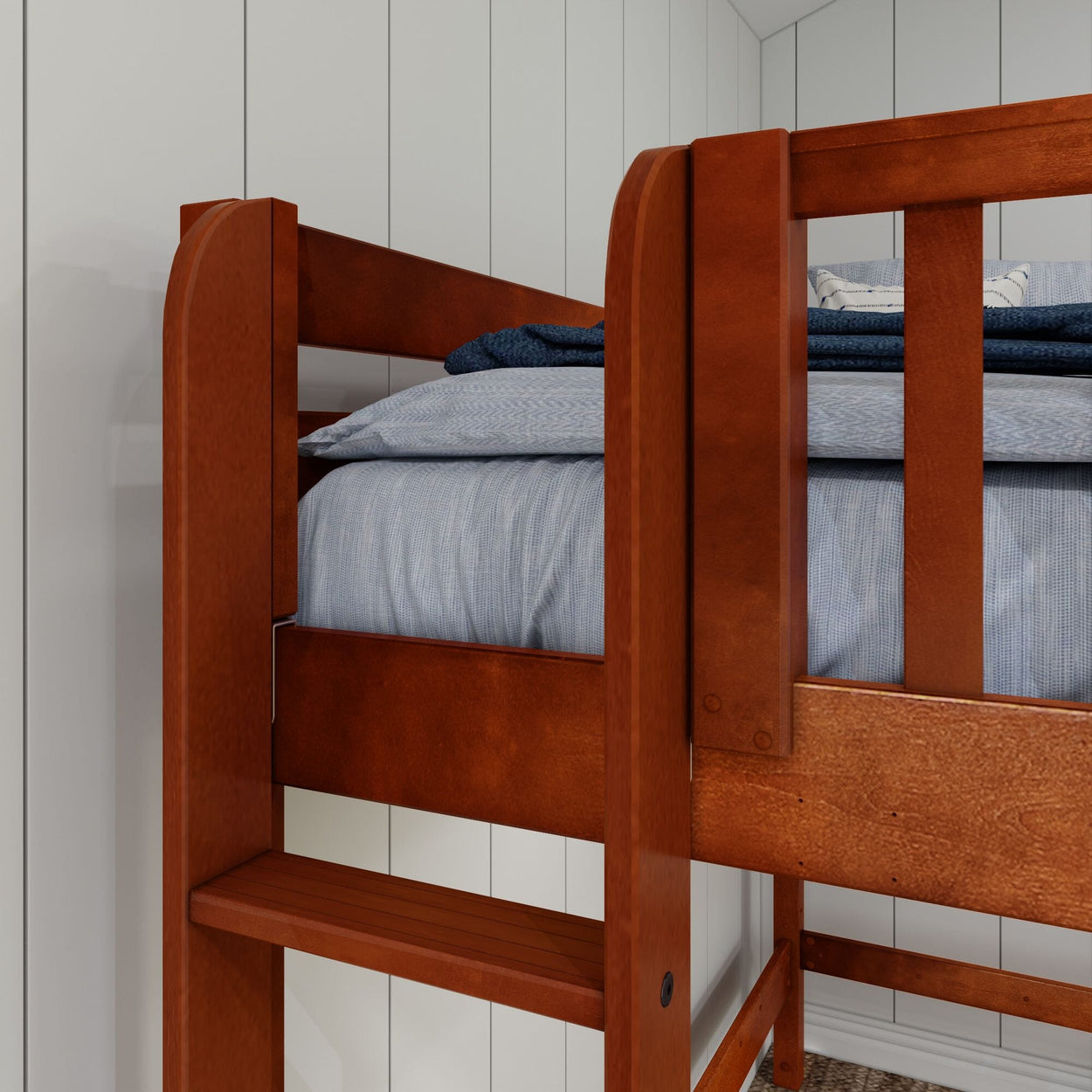 Wooden bunk bed with blue bedding in a modern bedroom setting.
