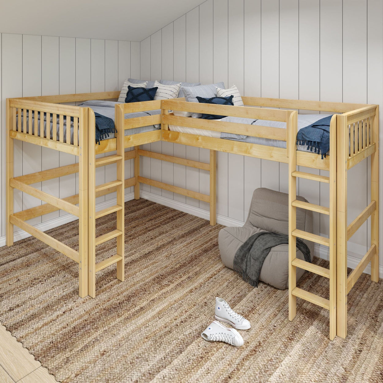 L-shaped wooden loft bed with ladder in a cozy bedroom setting, featuring beige carpet and casual seating.