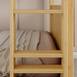 Wooden bunk bed ladder next to cozy bed with beige bedding in modern bedroom.