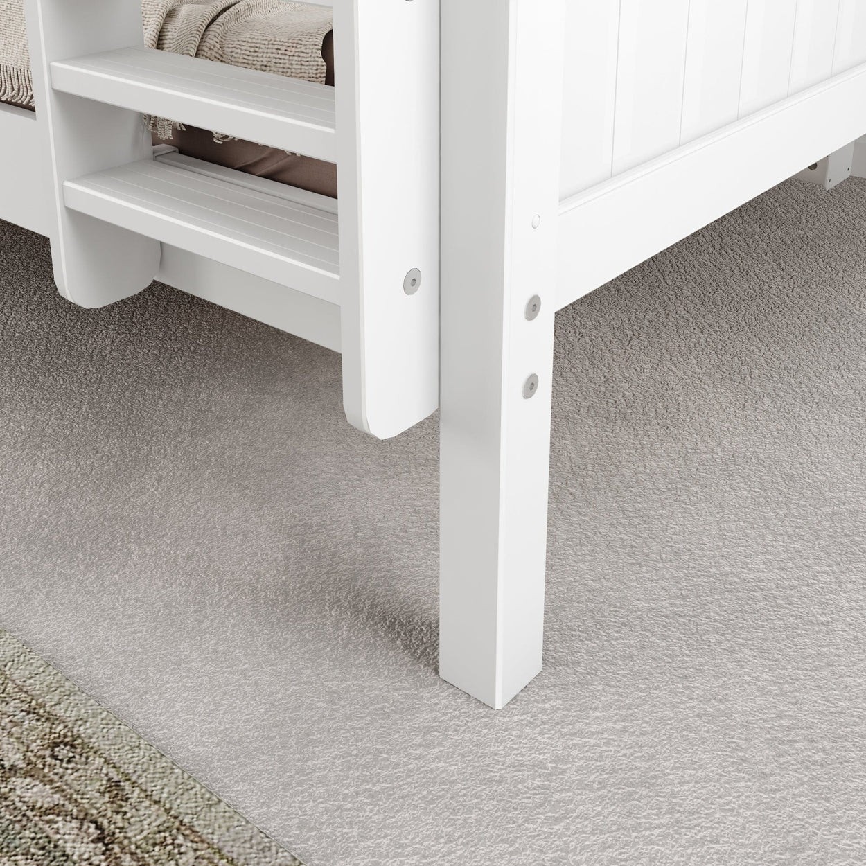 White wooden bunk bed ladder and frame on beige carpet.