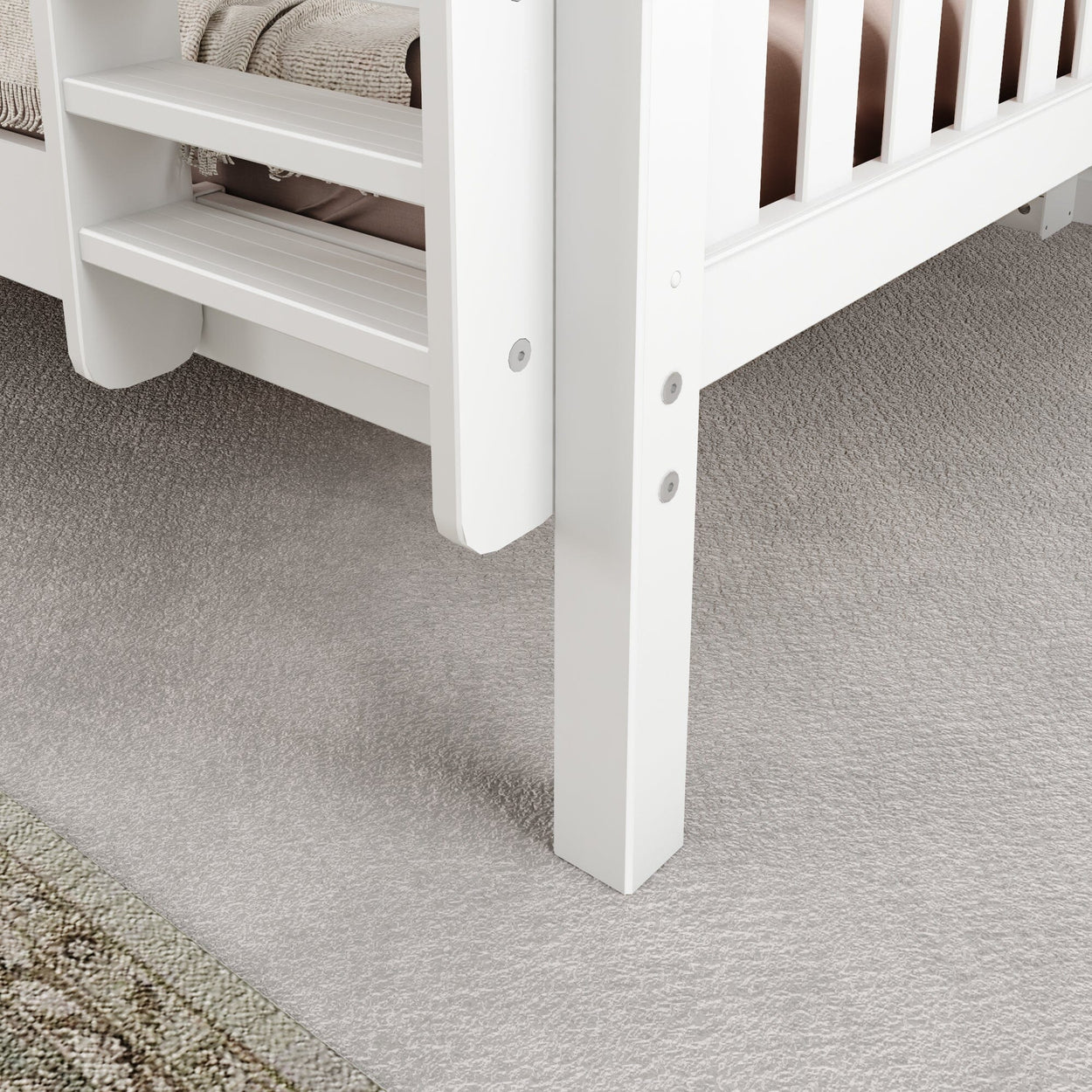 White wooden bed frame with ladder detail on soft gray carpet flooring in modern bedroom.