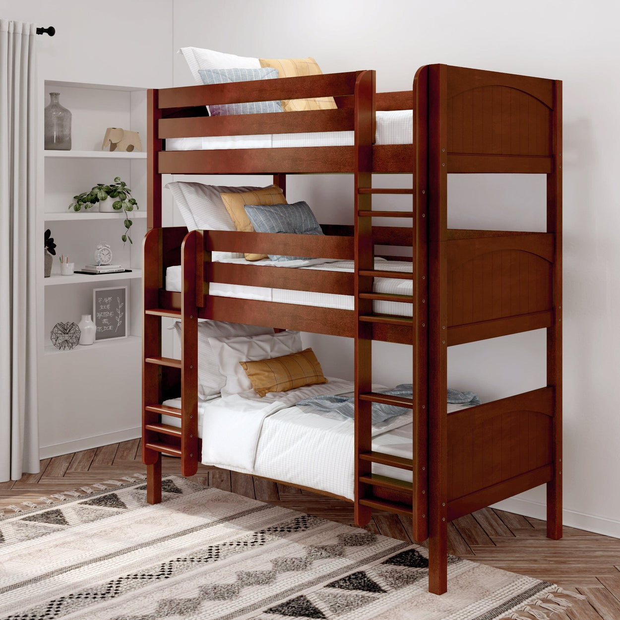 Wooden triple bunk bed with clean white bedding in a cozy bedroom with a patterned area rug.