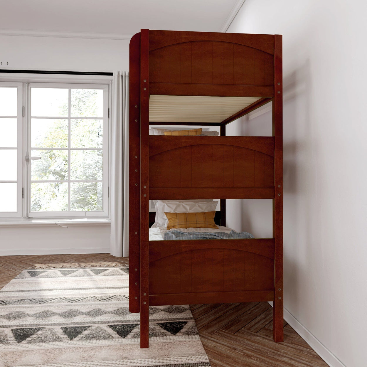 Wooden bunk bed in a bright bedroom with large window and patterned rug.