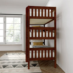 Wooden bunk bed with striped bedding in a bright bedroom with a large window and patterned rug.