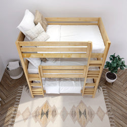 Wooden bunk bed with twin mattresses and white bedding, placed on a chevron-patterned wooden floor with a geometric rug and potted plant nearby.