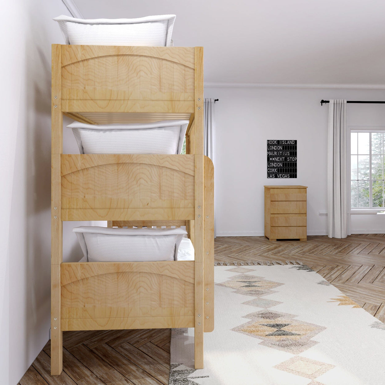 Wooden triple bunk beds in a modern bedroom with natural light and minimalistic decor.