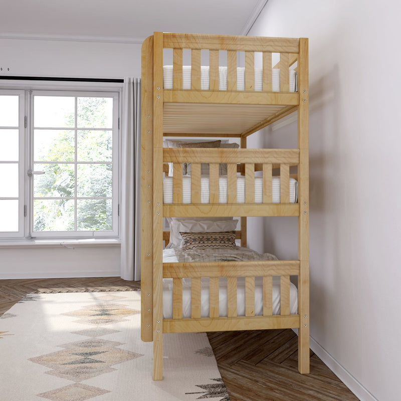 Natural wood twin-over-twin bunk bed with white mattresses and patterned pillows in a bright minimalist kids bedroom by a large window