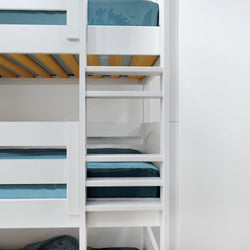 White wooden bunk bed with blue linens and ladder in modern bedroom setting.