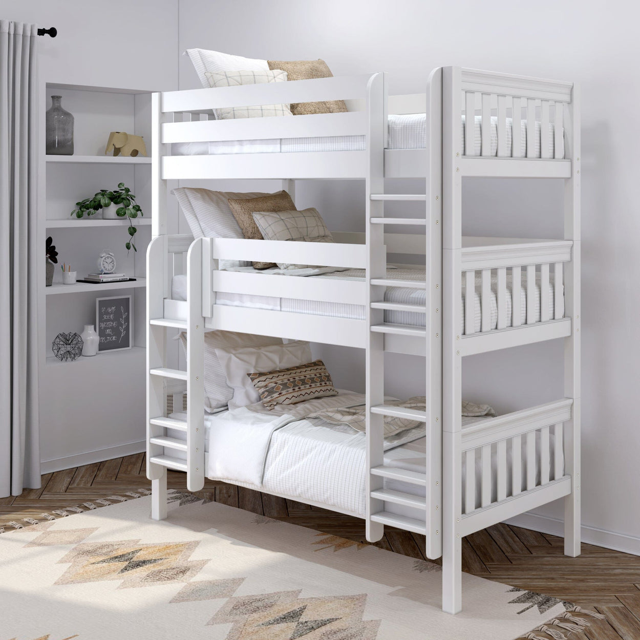 White triple bunk bed with modern design in a cozy bedroom setting, featuring wooden floors and decorative pillows.