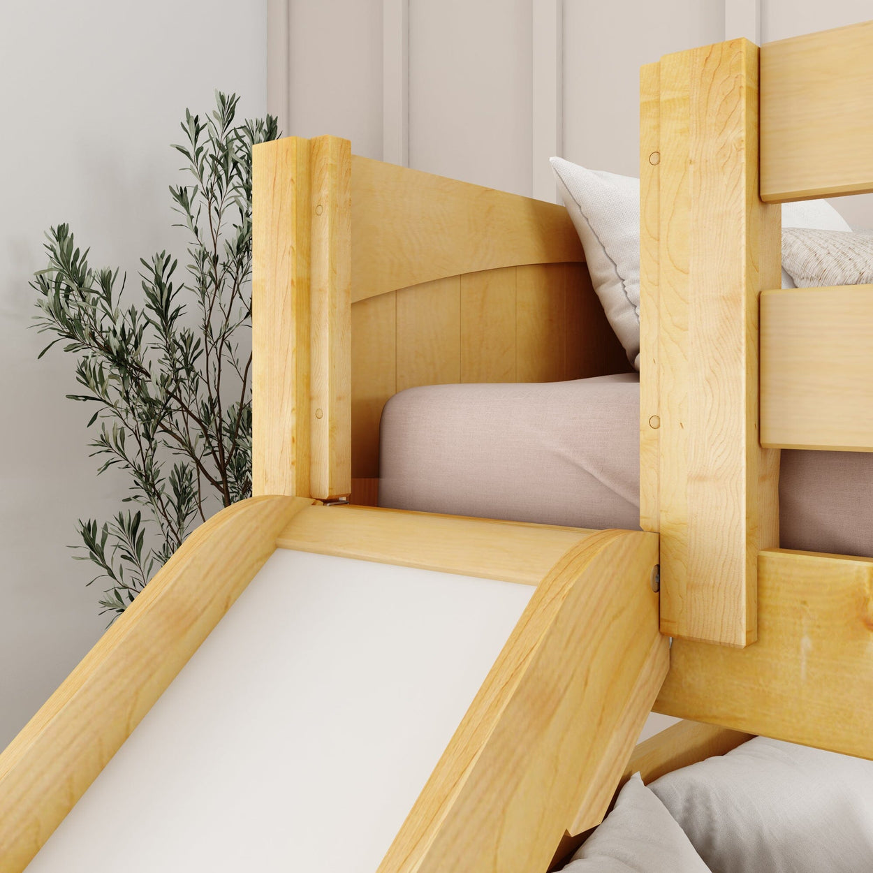 Wooden bunk bed with slide in a modern bedroom setting, featuring comfortable bedding and decorative plant.