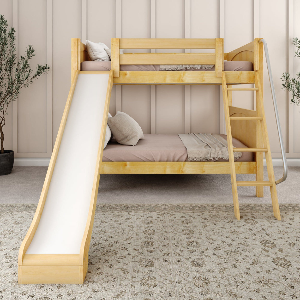 Wooden bunk bed with slide and ladder in a cozy children's bedroom.