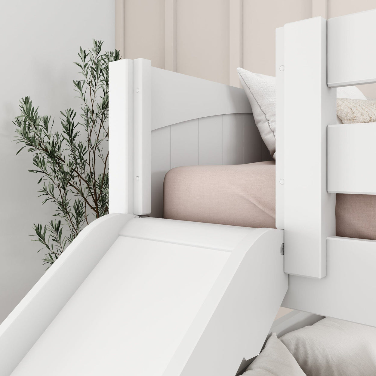 White wooden bed with slide and pink bedding, modern kids’ bedroom furniture.