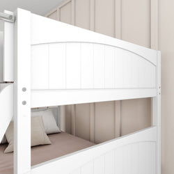 White wooden bunk bed with beige bedding and pillows against a cream-colored wall.