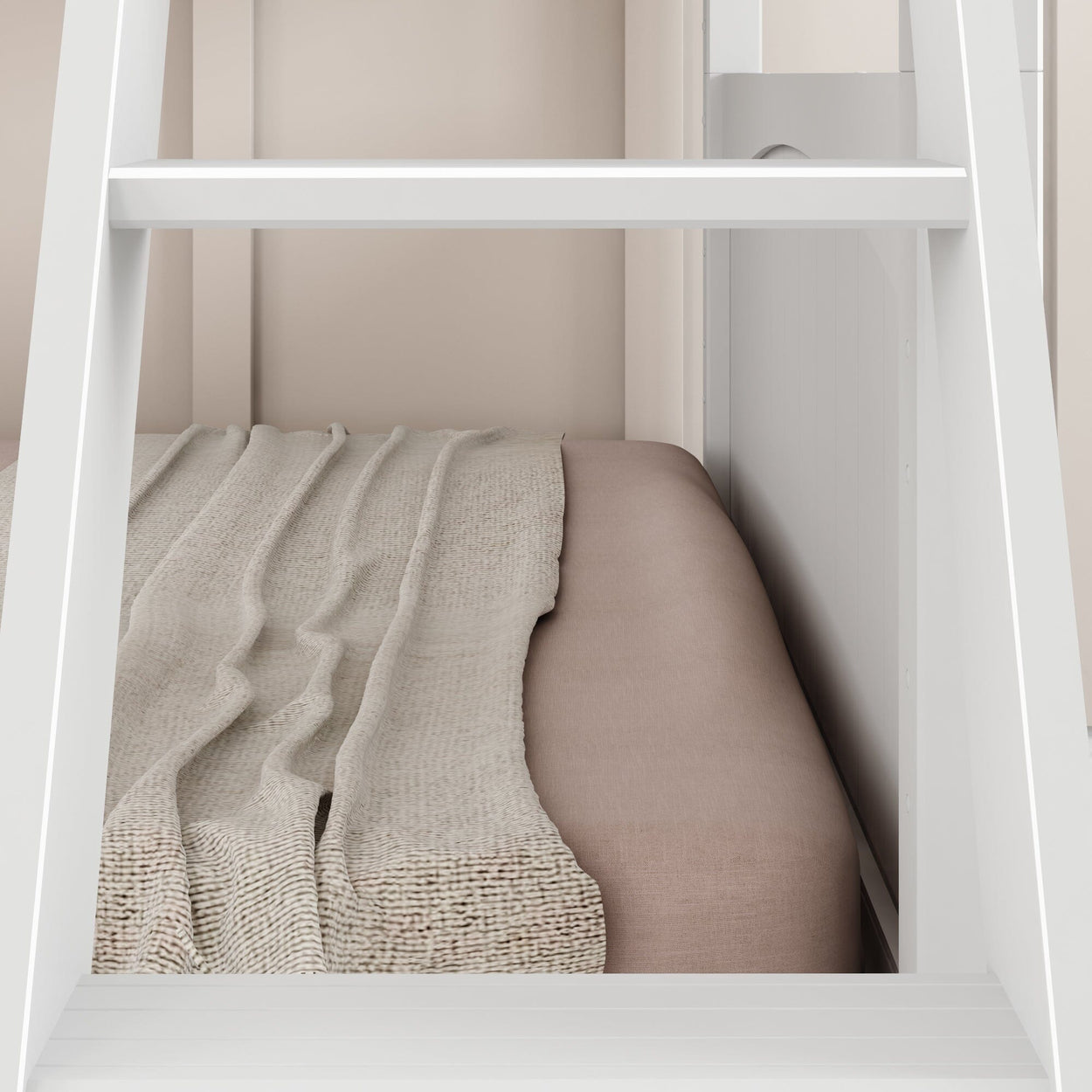 Beige bedding with textured blanket on a cozy bed frame.