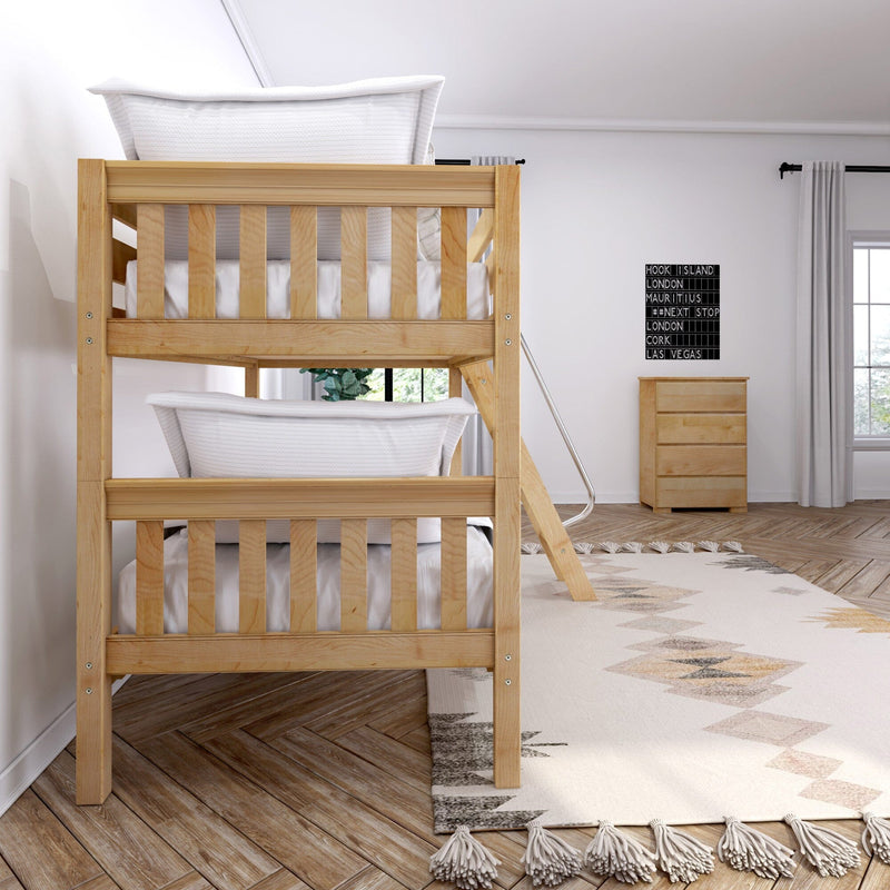 Natural wood bunk bed with white bedding and ladder in a bright modern kids' bedroom featuring a tassel geometric rug, wooden dresser, and neutral decor