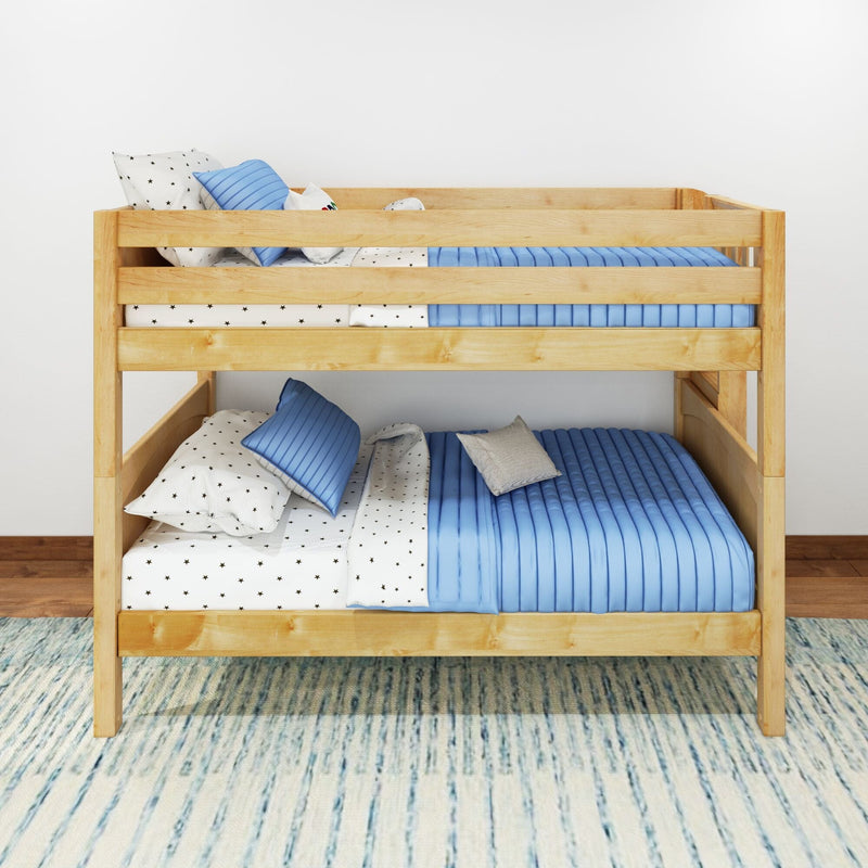 Wooden bunk bed with blue quilted bedding, star-print sheets and pillows in a modern kids' bedroom with white wall and area rug