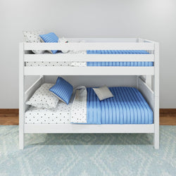 White wooden bunk bed with blue striped bedding and polka dot pillows in a modern bedroom setting.