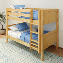 Wooden bunk bed with blue bedding in a cozy children's bedroom.
